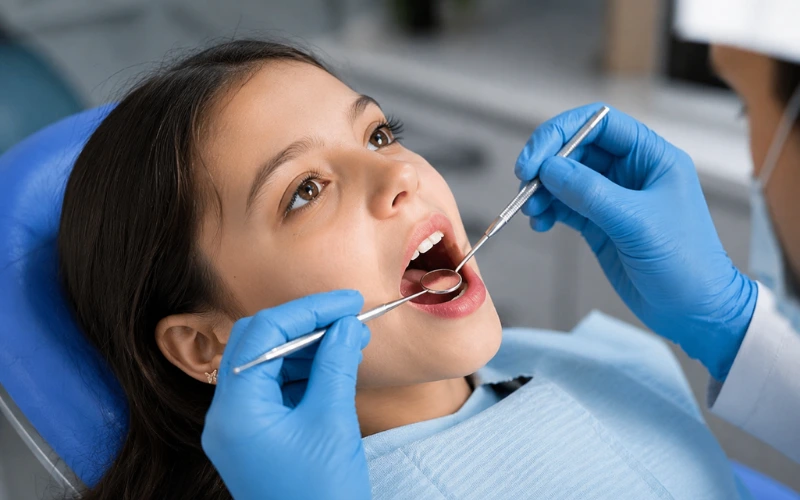 Dentist performing a dental checkup at ZSK Clinic Islamabad